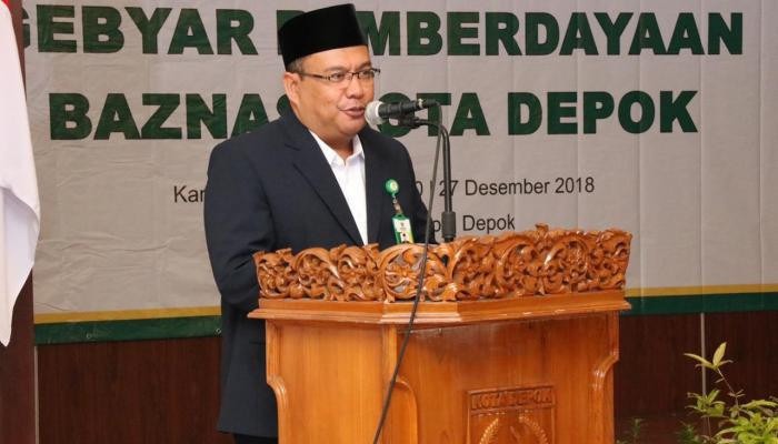 Ketua Baznas Kota Depok, Encep Hidayat saat membeberkan akan menyalurkan bantuan Rp155 Juta untuk program D'Sunting Menara. (istimewa).