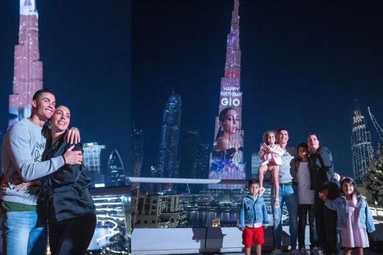 Georgina Rodriguez berpose dengan gambar dirinya yang ditayangkan di videotron Burj Khalifa. (CRISTIANO RONALDO/INSTAGRAM )