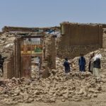 Penduduk desa dan pejabat memeriksa tingkat kerusakan di sebuah desa di distrik Bernal, provinsi Paktika, Afghanistan [Ahmad Sahel Arman/AFP]