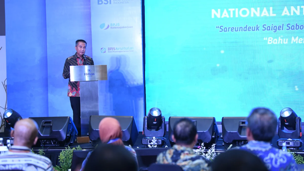 Penjabat Gubernur Jawa Barat Bey Machmudin memberikan sambutan pada acara National Anti Fraud Conference 2024 di Hotel Hilton Bandung, Kamis (5/9/2024).(Foto: Biro Adpim Jabar)