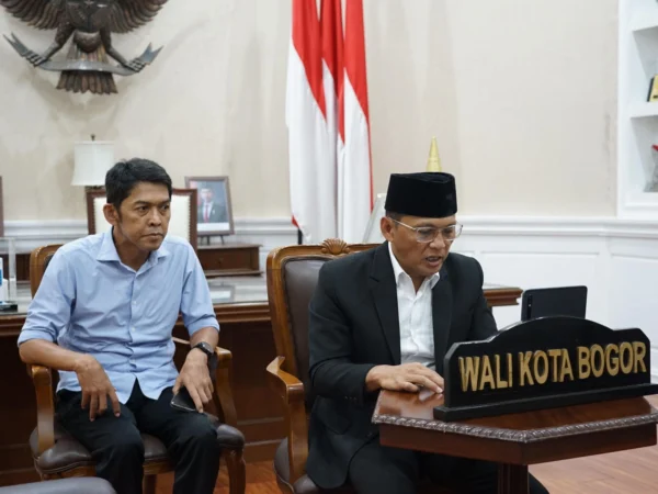 Pj Wali Kota Bogor, Hery Antasari bersama Kadiskominfo Kota Bogor. (Foto: Yudha Prananda / Istimewa)