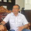 Kepala Dinas Kependudukan dan Catatan Sipil (Disdukcapil) Kabupaten Bandung, Yudi Abdurahman saat ditemui di ruang kerjanya, Rabu (23/4/2025). Foto Agi/Jabar Ekspres/